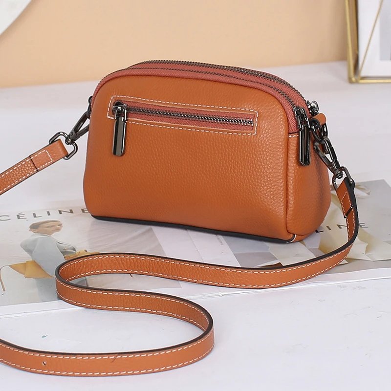 กระเป๋าสะพายข้างหนังวัวแท้ ดีไซน์ Clutches น่ารัก พร้อม 2 ช่องซิป! - Image 9